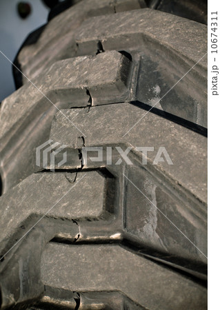 Giant old damaged tire Giant old damaged tire 10674311