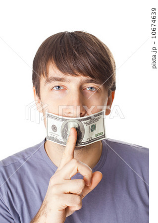 Young man with his mouth sealed by a hundred dollar bills isolat Young man with his mouth sealed by a hundred dollar bills isolat 10674639