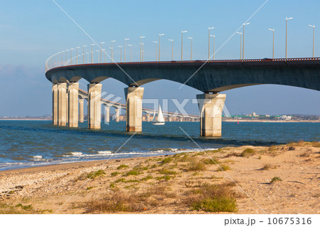 Curved Concrete Bridge over the water Curved Concrete Bridge over the water 10675316