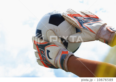 Goalkeeper catches the ball 10676589