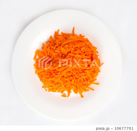 shredded carrots on a white plate 10677701