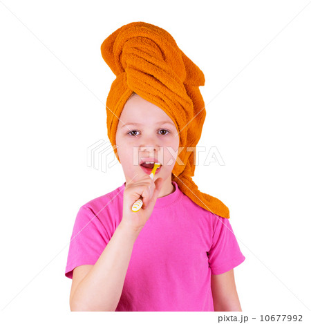 Girl brushing her teeth on a white background Girl brushing her teeth on a white background 10677992