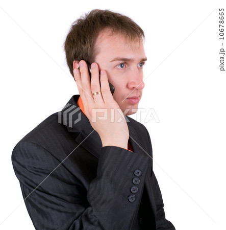 The businessman speaks by a mobile phone The businessman speaks by a mobile phone 10678665