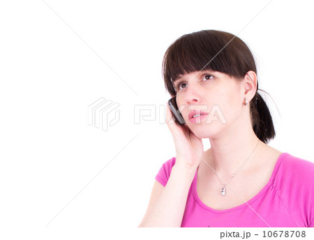 The young woman talks by a mobile phone The young woman talks by a mobile phone 10678708