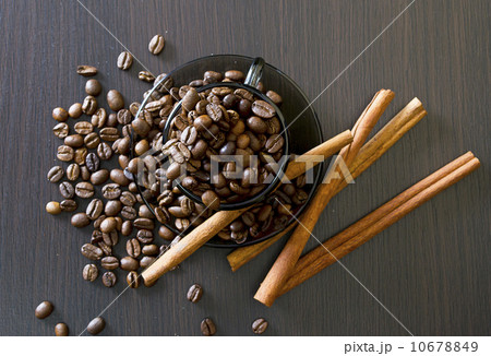coffee beans, cup, Pots, cinnamon on dark background 10678849