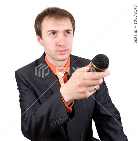 The young man with a microphone interviews 10679147