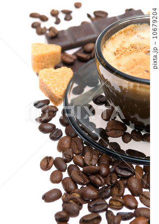 Cappuccino, brown sugar and coffee beans on white background Cappuccino, brown sugar and coffee beans on white background 10679204