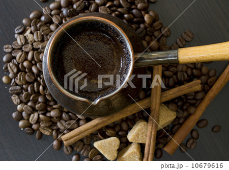 coffee beans, Pots, cinnamon on dark background 10679616