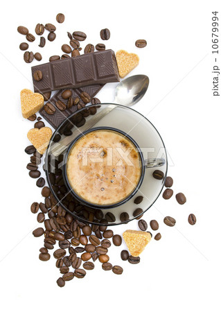 Cappuccino, brown sugar and coffee beans on white background Cappuccino, brown sugar and coffee beans on white background 10679994