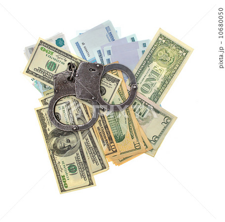 handcuffs and money isolated on a white background handcuffs and money isolated on a white background 10680050