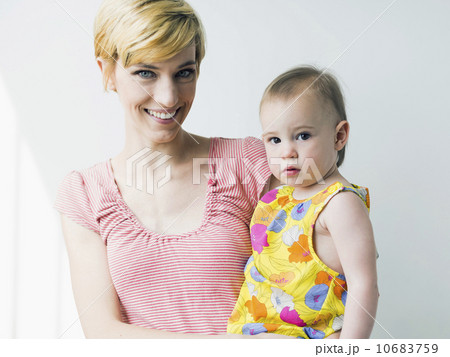 Portrait of mother holding daughter (12-17 months) 10683759