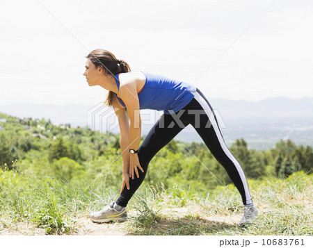Female jogger stretching 10683761