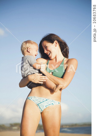 Mother with baby boy (6-11) in arms 10683768