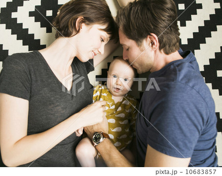 Portrait of parents with baby son (2-5 months) Portrait of parents with baby son (2-5 months) 10683857