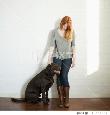 Portrait of attractive young woman and her dog 10683925