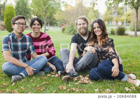 Portrait of group of friends sitting on grass Portrait of group of friends sitting on grass 10684088