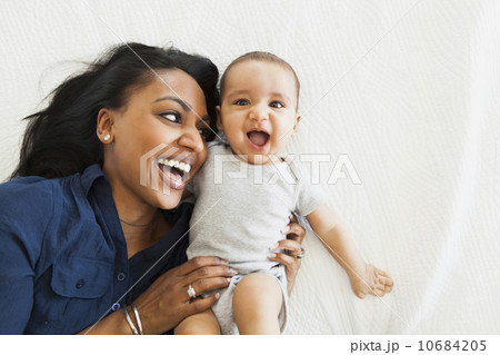 Mother with baby boy (2-5 months) hugging and laughing 10684205
