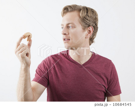 Man holding fortune cookie 10684545