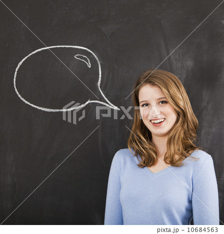 Studio portrait of woman with chalk speech bubble 10684563