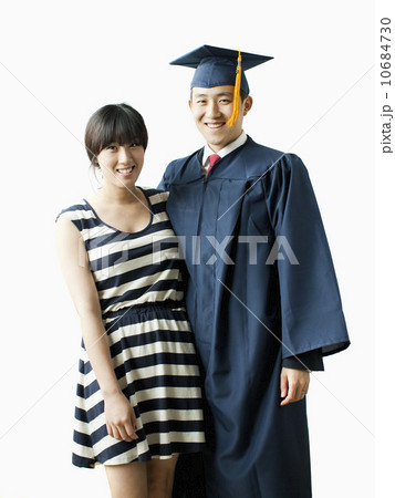 Portrait of young couple, man in graduation gown 10684730