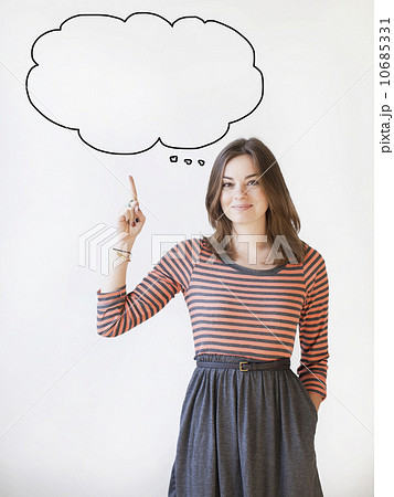 Studio shot young woman pointing up on thought bubble 10685331