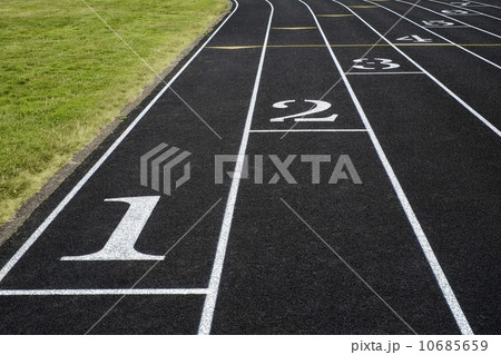 Empty running tracks in sports stadium Empty running tracks in sports stadium 10685659