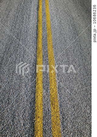 Close-up of double yellow line on road Close-up of double yellow line on road 10686236