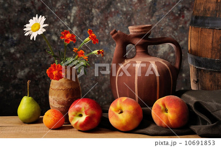 Jar decorated with flowers and apples 10691853