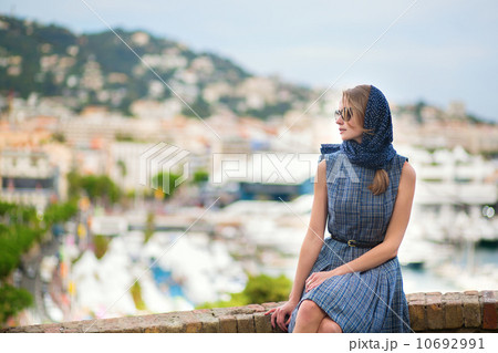 Elegant young woman in the Old town of Cannes 10692991