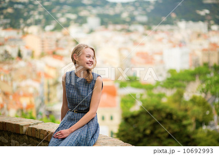 Elegant young woman in the Old town of Cannes 10692993