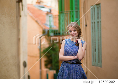 Elegant young woman in the Old town of Cannes 10693002