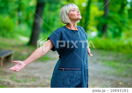 attractive woman breathing and relaxing outside 10693161