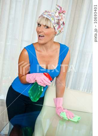 woman cleaning glass table woman cleaning glass table 10693401