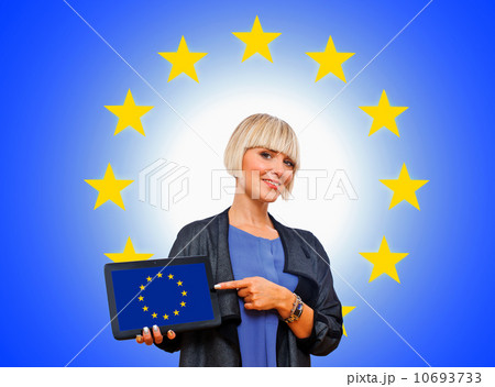 attractive blond woman holding tablet with european flag attractive blond woman holding tablet with european flag 10693733