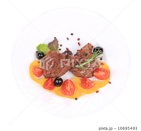 Beef steaks with rosemary and tomatoes. 10695493