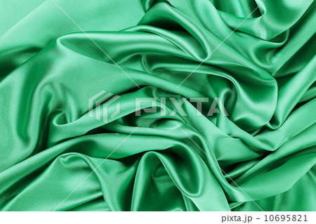 Soft folds and highlights of light green silk. 10695821