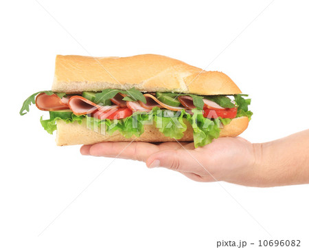 Baguette sandwich in hand. 10696082