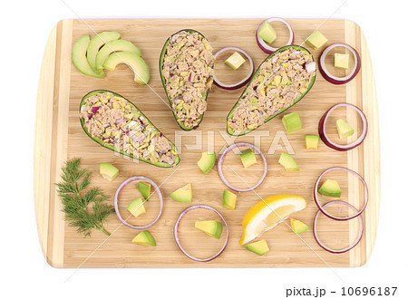 Avocado salad with tuna on cutting board. 10696187