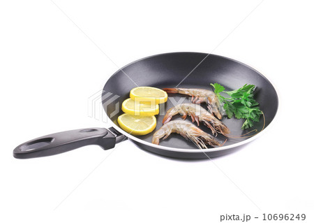 Fresh shrimps on pan with lemon. 10696249