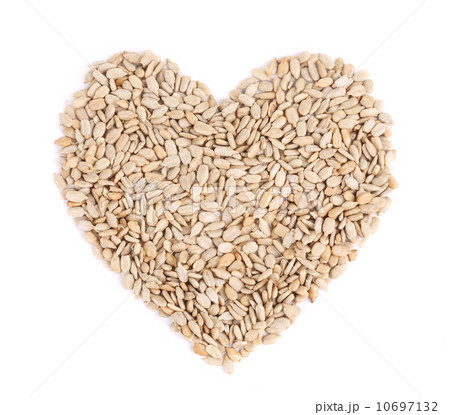 Heart shape of pelled sunflower seeds. 10697132