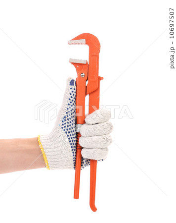 Wrench in white and yellow glove. 10697507