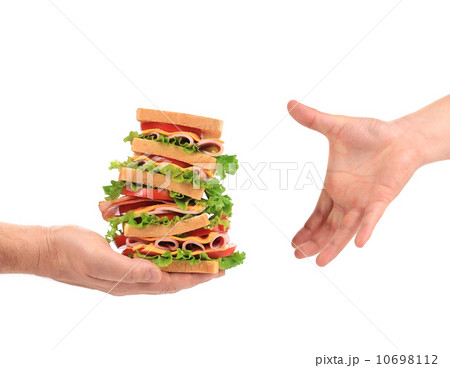 Big fresh sandwich in hands. 10698112