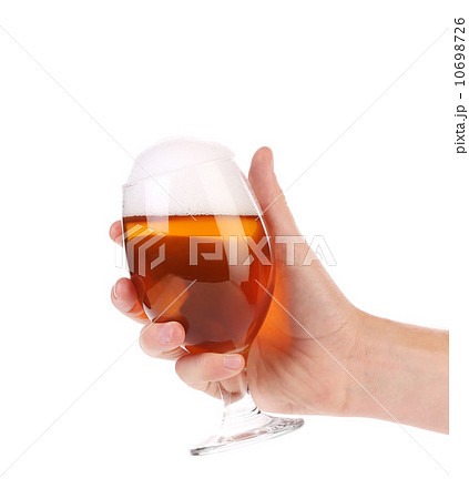 Hand holds glass of beer. Hand holds glass of beer. 10698726