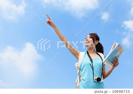 Happy women traveler pointing Happy women traveler pointing 10698733