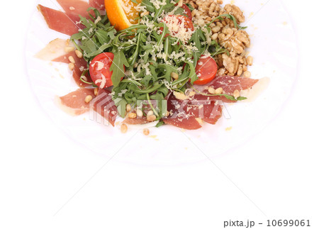 Salad with arugula and prosciutto. 10699061