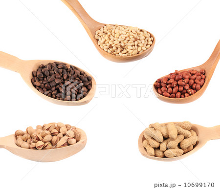 Collage of different nuts in spoons. Collage of different nuts in spoons. 10699170