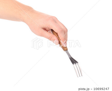 Close up of kitchen fork in hand Close up of kitchen fork in hand 10699247