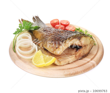 Baked fish on wooden board 10699763