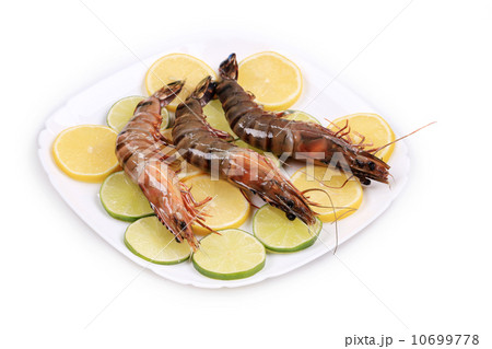 Shrimp lemon and lime on plate. Shrimp lemon and lime on plate. 10699778