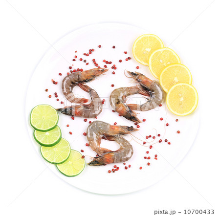 Raw shrimps on plate. 10700433